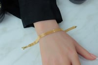 اسوارة ذهب ايطالي شكل ثلاث شرايط عيار 18 وزن 5.4 ج...