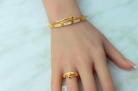 اسوارة مع خاتم ذهب المسمار عيار 21 بنقش الكارتير