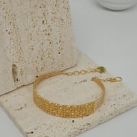 اسوارة بتصميم كرات الدوريكاء الذهبية ذهب عيار 21 و...