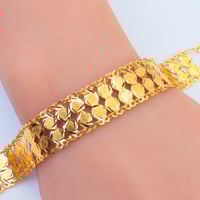 سوارة ذهب تصميم الجنيهات دورين عيار 21 وزن 9.56 جر...