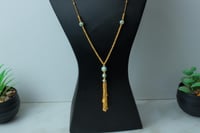 سبحة طويلة ذهب عيار 21 مطعمة بالميناء وزن 15.89 جر...