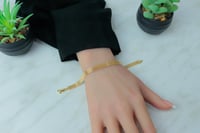 اسوارة ذهب ايطالي شكل ثلاث شرايط عيار 18 وزن 5.4 ج...