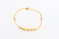 سوارة ذهب تصميم كرات الدوريكاء عيار 21 وزن 4.5 جرا...