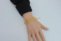 اسوارة ذهب غصن الزيتون ثلاثة دور عيار 21 وزن10.7 ج...