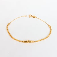 اسوارة ذهب المبروم تصميم كرات ليزر عيار 18 وزن 1.4...