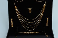 طقم ذهب الشلال خمسة دور عيار 21