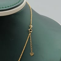 طقم ذهب صافي عيار 18 – تصميم دوائري ناعم بوزن 6.56...