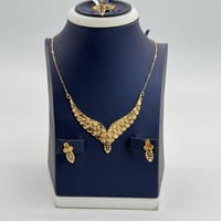 طقم ذهب جناح الصقر ذهب صافي عيار 21 وزن 10.57 جرام