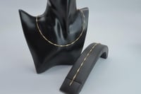 كلكشن عقد واسوارة الاوميقاء ذهب عيار 18 وزن 2.23 ج...