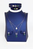 طقم ذهب بوشرون الملون تصميم الماسي عيار 18 وزن 4.4...