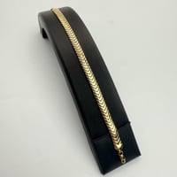 سوارة ايطالي تصميم غصن الزيتون ذهب صافي عيار 21 وز...