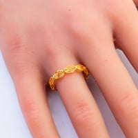 دبلة ذهب عيار 21 تصميم متشابك وزن 1.48 جرام – نعوم...