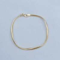 كلكشن عقد واسوارة الاوميقا المطاطي ذهب عيار 18 وزن...