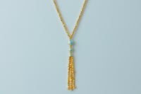 سبحة طويلة ذهب عيار 21 مطعمة بالميناء وزن 15.89 جر...