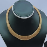 طقم ذهب الاوميقاء عيار 18 وزن 32.24 جرام