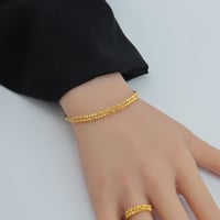 اسوارة مع خاتم ذهب عيار 21 بتصميم الدوريكاء وزن 7....