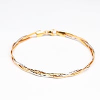 سوارة ذهب بتصميم متداخل عيار 18 وزن 4.2 جرام من ال...