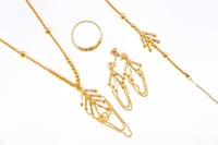 طقم ذهب عيار 21 تصميم حبات الدوريكاء بوزن 13.4 جرا...