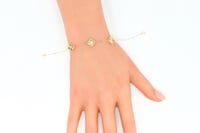 سوارة الفان كليف ثلاث وردات عيار 18 وزن 1.9 جرام