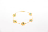 سوارة الرمش خمس وردات باللون الفيروزي عيار 21