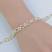 سوارة ذهب مطعم بالؤلؤ الصناعي عيار 18 وزن 1.59 جرا...