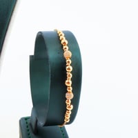 طقم ذهب تصميم كرات الدوريكاء عيار 21 وزن 18.14 جرا...