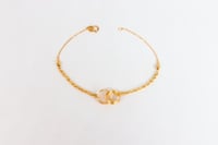 سوارة ذهب المبروم تصميم الحلقات عيار 18 وزن 1.6 جر...