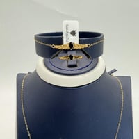 طقم ذهب جناح الصقر باللون الكحلي عيار 21 وزن 3.9 ج...