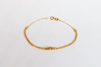 اسوارة ذهب المبروم تصميم كرات ليزر عيار 18 وزن 1.4...