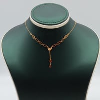 عقد ذهب عيار 21 بحلقات هندسية وزن 0.92 جرام بتصميم...