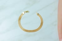 اسوارة ذهب ايطالي شكل ثلاث شرايط عيار 18 وزن 5.4 ج...