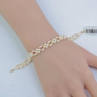 سوارة ذهب مطعم بالؤلؤ الصناعي عيار 18 وزن 1.59 جرا...