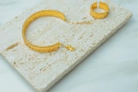 اسوارة مع خاتم ذهب عيار 21 تصميم الدوربكاء وزن 17...