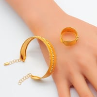 سوارة مع خاتم ذهب عيار 21 وزن 12.2 جرام بتصميم طبق...