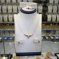 طقم ذهب جناح الصقر الماسي عيار 21 – أناقة فاخرة بو...