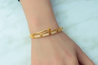 اسوارة مع خاتم ذهب المسمار عيار 21 بنقش الكارتير