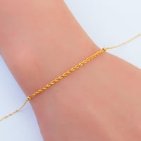 سوارة ذهب تصميم المبروم ناعمة عيار 21 وزن 0.77 جرا...