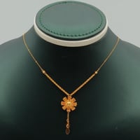 عقد ذهب عيار 21 زهرة مشعة وزن 2.15 جرام بتعليقة أن...