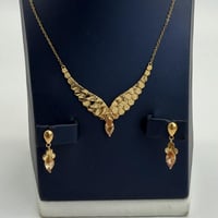 طقم ذهب جناح الصقر تصميم الماسي عيار 21 وزن 7.94 ج...