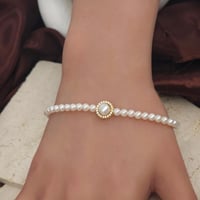 اسوارة مطعم بالؤلؤ الزراعي بتصميم الماسي ذهب عيار...