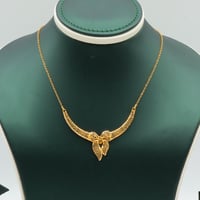 طقم ذهب عيار 21 وزن 6.33 جرام بتصميم أجنحة انسيابي...