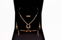 طقم ذهب TIGER فخم عيار 21 | متجر الكنوز الذهبية