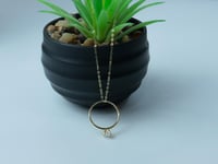 سلسال ذهب بتعليقة مصممة بشكل خاتم عيار 18 وزن 1.3...