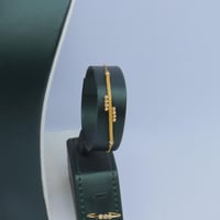 طقم ذهب عيار 21 مبروم بتصميم كرات الدوريكاء وزن 11...