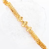 سوارة ذهب غصن الزيتون بتصميم الفان كليف عيار 21 وز...