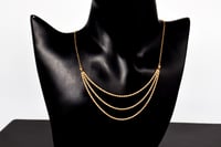 سلسال المبروم ثلاثة دور عيار 21 وزن 1.9 جرام