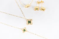 طقم روبيرتو كوين باللون الزيتي عيار 18