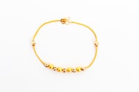 سوارة ذهب تصميم كرات الدوريكاء عيار 21 وزن 4.5 جرا...