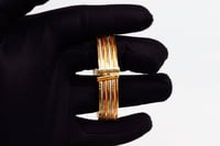 اسوارة ذهب عريضة عيار 18 بتصميم ايطالي وزن 21.9 جر...