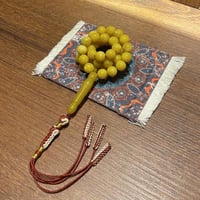 سبحة بكلايت بـ لون الكهرمان